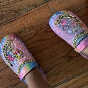Cynthia Vuitton Crocs, designer charms, bedazzled trim and pearls hand designed.